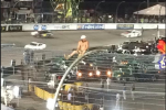 Crazy NASCAR Fan Sits Atop Fence During Race