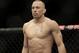 Georges St. Pierre, of Canada, waits to begin a UFC 167 mixed martial arts championship welterweight bout against Johny Hendricks on Saturday, Nov. 16, 2013, in Las Vegas. St. Pierre won by split decision. (AP Photo/Isaac Brekken)