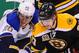 BOSTON, MA - NOVEMBER 21: Dougie Hamilton #27 of the Boston Bruins fights for the puck against Alexander Steen #20 of the St. Louis Blues at the TD Garden on November 21, 2013 in Boston, Massachusetts. (Photo by Steve Babineau/NHLI via Getty Images)