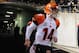 Cincinnati Bengals quarterback Andy Dalton (14) takes the field to warm up before an NFL football game against the Pittsburgh Steelers, Sunday, Dec. 28, 2014 in Pittsburgh. (AP Photo/Don Wright)