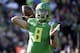 Oregon quarterback Marcus Mariota prepares to throw against Florida State during the first half of the Rose Bowl NCAA college football playoff semifinal, Thursday, Jan. 1, 2015, in Pasadena, Calif. (AP Photo/Jae C. Hong)