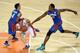 INCHEON, SOUTH KOREA - SEPTEMBER 25: Mahdi Kamrani of Iran is challenged by June Mar Fajardo of the Philippines during the Basketball Mens Preliminary round match between Iran and the Philippines during day five of the 2014 Asian Games at Hwaseong Sports Complex Gymnasium on September 25, 2014 in Incheon, South Korea. (Photo by Stanley Chou/Getty Images)