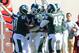 EAST LANSING, MI - NOVEMBER 05: Michigan State Spartans players congratulate Trenton Robinson #39 after he intercepted a MarQueis Gray #5 of the Minnesota Golden Gophers pass in the third quarter of the game at Spartan Stadium on November 5, 2011 in East Lansing, Michigan. The Spartans defeated the Gophers 31-24. (Photo by Mark A. Cunningham/Getty Images)