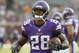 In this Aug. 16, 2014, photo, Minnesota Vikings running back Adrian Peterson (28) warms up before a NFL preseason football game against the Arizona Cardinals in Minneapolis.Millions of people using the top three fantasy football platforms have generated three different answers to the question of that top draft pick. Yahoo says LeSean McCoy of Philadelphia. ESPN says Adrian Peterson. CBS Sports says it's Jamaal Charles of Kansas City. (AP Photo/Ann Heisenfelt)
