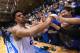 DURHAM, NC - FEBRUARY 21: Quinn Cook #2 of the Duke Blue Devils celebrates with fans after a win against the Clemson Tigers at Cameron Indoor Stadium on February 21, 2015 in Durham, North Carolina. Duke won 78-56. (Photo by Grant Halverson/Getty Images)