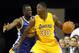 Los Angeles Lakers forward Julius Randle (30) backs in against Golden State Warriors forward Draymond Green, left, during the second half of a preseason NBA basketball game, Sunday, Oct. 12, 2014, in Ontario, Calif. The Warriors won 116-75. (AP Photo/Alex Gallardo)