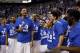 Kentuck's Willie Cauley-Stein, fourth from left, celebrates with teammates during a ceremony marking the teams undefeated regular season after an NCAA college basketball game, Saturday, March 7, 2015, in Lexington, Ky. Kentucky won 67-50. (AP Photo/James Crisp)