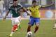 Mexico's Hector Herrera, left, pressures Ecuador forward Jefferson Montero (7) during the first half of a friendly soccer match, Saturday, May 31, 2014, in Arlington, Texas. (AP Photo/Tony Gutierrez)