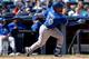 NEW YORK, NY - APRIL 06: Devon Travis #29 of the Toronto Blue Jays hits a solo home run in the seventh inning against the New York Yankees during Opening Day on April 6, 2015 at Yankee Stadium in the Bronx borough of New York City. (Photo by Elsa/Getty Images)