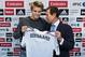 Norway international soccer player Martin Odegaard, left, poses with Real Madrid's representative Emilio Butragueno, during his official presentation in Madrid, Spain, Thursday, Jan. 22, 2015, after signing for Real Madrid. (AP Photo/Andres Kudacki)