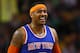 New York Knicks' Carmelo Anthony smiles during the second half of the New York Knicks 101-95 win over the Boston Celtics in an NBA basketball game in Boston Friday, Dec. 12, 2014. (AP Photo/Winslow Townson)