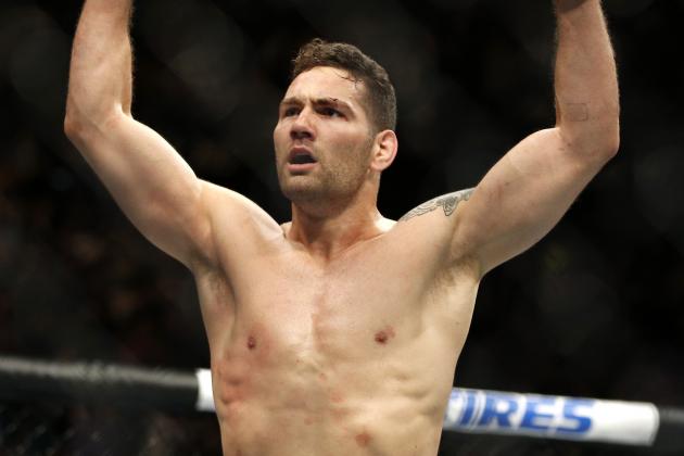 UFC Champ Chris Weidman Poses with Less-Than-Happy Floyd Mayweather