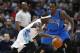 Denver Nuggets guard Ty Lawson (3), left, drives for a shot past Dallas Mavericks forward Al-Farouq Aminu (7) in the first quarter of an NBA basketball game Friday, April 10, 2015, in Denver. (AP Photo/David Zalubowski)