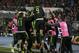 Mexico's players celebrate after scoring their third goal against Chile during a Copa America Group A soccer match at El Nacional stadium in Santiago, Chile, Monday, June 15, 2015. (AP Photo/Ricardo Mazalan)