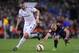 Real Madrid's Karim Benzema, left, takes the ball past Barcelona's Javier Mascherano during a Spanish La Liga soccer match between FC Barcelona and Real Madrid at Camp Nou stadium, in Barcelona, Spain, Sunday, March 22, 2015. (AP Photo/Manu Fernandez)