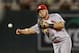 St. Louis Cardinals shortstop Jhonny Peralta throws to first after fielding a ball hit by the Minnesota Twins in the eighth inning of a baseball game Wednesday, June 17, 2015, in Minneapolis. Originally ruled an out, a replay challenge reversed the call and the play was an RBI hit. (AP Photo/Bruce Kluckhohn)