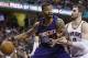 Phoenix Suns' Markieff Morris, left, drives past Cleveland Cavaliers' Kevin Love during the third quarter of an NBA basketball game Saturday, March 7, 2015, in Cleveland. The Cavaliers defeated the Suns 89-79. (AP Photo/Tony Dejak)