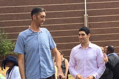 World's tallest man dwarfs NBA center