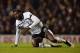 LONDON, ENGLAND - JANUARY 21: Emmanuel Adebayour of Spurs pulls himself to his feet during the Capital One Cup Semi-Final first leg match between Tottenham Hotspur and Sheffield United at White Hart Lane on January 21, 2015 in London, England. (Photo by Jamie McDonald/Getty Images)