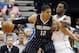 Minnesota Timberwolves’ Andrew Wiggins, right, defends Orlando Magic’s Tobias Harris in the first quarter of an NBA basketball game, Friday, April 3, 2015, in Minneapolis. (AP Photo/Jim Mone)