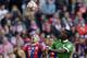 Bremen's Assani Lukimya from Congo, right, and Bayern's Arjen Robben from the Netherlands challenge for the ball during the German first division Bundesliga soccer match between FC Bayern and SV Werder Bremen in the Allianz Arena in Munich, Germany, on Saturday, Oct. 18, 2014. (AP Photo/Matthias Schrader)