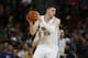 Denver Nuggets center Jusuf Nurkic, of Bosnia Herzegovina, looks to pass the ball against the Utah Jazz in the fourth quarter of an NBA basketball game Friday, March 27, 2015, in Denver. The Nuggets won 107-91. (AP Photo/David Zalubowski)