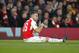 LONDON, ENGLAND - OCTOBER 20: Aaron Ramsey of Arsenal signals to the bench that he needs to be substituted during the UEFA Champions League match between Arsenal and Bayern Munich at The Emirates Stadium on October 20, 2015 in London, United Kingdom. (Photo by Mitchell Gunn/Getty Images)