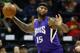 Sacramento Kings forward DeMarcus Cousins (15) grabs a rebound in the first half of an NBA basketball game against the Atlanta Hawks Wednesday, Nov. 18, 2015, in Atlanta. (AP Photo/John Bazemore)