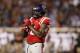 Mississippi offensive Mississippi offensive lineman Laremy Tunsil (78) adjust his gloves during his team's NCAA college football game against Texas A&M in Oxford, Miss., Saturday, Oct. 24, 2015. Tunsil was making his first start for the season having served a seven game suspension. No. 24 Mississippi won 23-3. (AP Photo/Rogelio V. Solis)