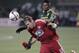 FC Dallas midfielder Ryan Hollingshead (12) battles Portland Timbers midfielder/forward Dairon Asprilla during the first half of the first leg of the MLS soccer Western Conference championship in Portland, Ore., Sunday, Nov. 22, 2015. (AP Photo/Steve Dipaola)