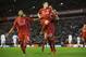 Liverpool's James Milner, centre, celebrates with teammates after scoring a penalty during the English Premier League soccer match between Liverpool and Swansea at Anfield Stadium, Liverpool, England, Sunday, Nov. 29, 2015. (AP Photo/Jon Super)