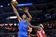 Oklahoma City Thunder center Steven Adams (12) shoots against Memphis Grizzlies forward Zach Randolph, right, in the first half of an NBA basketball game, Monday, Nov. 16, 2015, in Memphis, Tenn. (AP Photo/Brandon Dill)