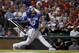 Toronto Blue Jays third baseman Josh Donaldson (20) swings against Texas Rangers during the sixth inning in Game 3 of baseball's American League Division Series Sunday, Oct. 11, 2015, in Arlington, Texas. (AP Photo/Tony Gutierrez)