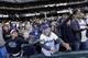 Fans reach for memorabilia tossed to them after a Seattle Mariners baseball game Sunday, Oct. 4, 2015, in Seattle. The Mariners won 3-2. (AP Photo/Elaine Thompson)