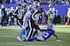 Side judge Michael Banks (72) separates Carolina Panthers' Josh Norman (24) and New York Giants' Odell Beckham (13) during the first half of an NFL football game Sunday, Dec. 20, 2015, in East Rutherford, N.J. (AP Photo/Julie Jacobson)