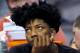 Orlando Magic guard Elfrid Payton (4) watches from the bench during the first half of an NBA basketball game against the Phoenix Suns, Wednesday, Dec. 9, 2015, in Phoenix. (AP Photo/Matt York)