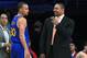 Golden State Warriors guard Stephen Curry, left, talks with coach Mark Jackson after achieving a triple-double, during the second half of an NBA basketball game against the Los Angeles Lakers, Friday, April 11, 2014, in Los Angeles. The Warriors won 112-95. (AP Photo/Mark J. Terrill)