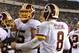 Washington Redskins' Pierre Garcon (88), Brandon Scherff (75) and Kirk Cousins (8) celebrate after a touchdown in the second half of an NFL football game against the Philadelphia Eagles, Saturday, Dec. 26, 2015, in Philadelphia. (AP Photo/Michael Perez)