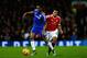 MANCHESTER, ENGLAND - DECEMBER 28: John Obi Mikel of Chelsea holds off a challenge from Anthony Martial of Manchester United during the Barclays Premier League match between Manchester United and Chelsea at Old Trafford on December 28, 2015 in Manchester, England. (Photo by Clive Mason/Getty Images)
