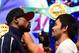 Floyd Mayweather and Manny Pacquiao face off following their weigh-in on May 1, 2015 in Las Vegas, Nevada one day before their 'Fight of the Century' on May 2 at the MGM Grand Garden Arena. AFP PHOTO / FREDERIC J. BROWN (Photo credit should read FREDERIC J. BROWN/AFP/Getty Images)
