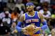 New York Knicks' Carmelo Anthony walks down the court after being called for an offensive foul in the second quarter of an NBA basketball game against the Atlanta Hawks Saturday, Dec. 26, 2015, in Atlanta. (AP Photo/David Goldman)