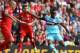 West Ham United's Senegalese striker Diafra Sakho (R) scores his team's third goal during the English Premier League football match between Liverpool and West Ham at the Anfield stadium in Liverpool, north-west England on August 29, 2015. AFP PHOTO / LINDSEY PARNABY RESTRICTED TO EDITORIAL USE. No use with unauthorized audio, video, data, fixture lists, club/league logos or 'live' services. Online in-match use limited to 75 images, no video emulation. No use in betting, games or single club/league/player publications. (Photo credit should read LINDSEY PARNABY/AFP/Getty Images)