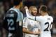 Real Madrid's French forward Karim Benzema (C) celebrates with Real Madrid's midfielder Jese (R) after scoring during the Spanish league football match Real Madrid vs RC Celta de Vigo at the Santiago Bernabeu stadium in Madrid on January 6, 2014. AFP PHOTO / GERARD JULIEN (Photo credit should read GERARD JULIEN/AFP/Getty Images)
