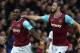 West Ham United's English midfielder Michail Antonio celebrates with West Ham United's English striker Andy Carroll (R) after scoring the opening goal of the English Premier League football match between West Ham United and Liverpool at The Boleyn Ground in Upton Park, East London on January 2, 2016. AFP PHOTO / JUSTIN TALLIS
RESTRICTED TO EDITORIAL USE. No use with unauthorized audio, video, data, fixture lists, club/league logos or 'live' services. Online in-match use limited to 75 images, no video emulation. No use in betting, games or single club/league/player publications. / AFP / JUSTIN TALLIS (Photo credit should read JUSTIN TALLIS/AFP/Getty Images)
