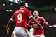 MANCHESTER, ENGLAND - JANUARY 02: Wayne Rooney (R) of Manchester United celebrates scoring his team's second goal with his team mate Anthony Martial (L) during the Barclays Premier League match between Manchester United and Swansea City at Old Trafford on January 2, 2016 in Manchester, England. (Photo by Alex Livesey/Getty Images)