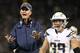 San Diego Chargers head coach Mike McCoy gestures next to running back Danny Woodhead (39) during the second half of an NFL football game against the Oakland Raiders in Oakland, Calif., Thursday, Dec. 24, 2015. (AP Photo/Tony Avelar)