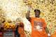 Clemson quarterback Deshaun Watson (4) throws oranges to the crowd after his team won the Orange Bowl NCAA college football semifinal playoff game against Oklahoma, Thursday, Dec. 31, 2015, in Miami Gardens, Fla. Clemson defeated Oklahoma 37-17. (AP Photo/Joe Skipper)