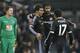 Chelsea's Oscar, front left, hugs Diego Costa, centre, and, Pedro, right, as he celebrates scoring a goal during the English Premier League soccer match between Crystal Palace and Chelsea at Selhurst Park stadium in London, Sunday, Jan. 3, 2016. (AP Photo/Kirsty Wigglesworth)