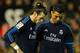 Real Madrid's Welsh forward Gareth Bale (L) and Real Madrid's Portuguese forward Cristiano Ronaldo look down during the Spanish league football match Valencia CF vs Real Madrid CF at the Mestalla stadium in Valencia on January 3, 2016. AFP PHOTO/ JOSE JORDAN / AFP / JOSE JORDAN (Photo credit should read JOSE JORDAN/AFP/Getty Images)