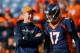 DENVER, CO - DECEMBER 13: Injured quarterback Peyton Manning of the Denver Broncos, left, has a word with quarterback Brock Osweiler #17 as players warm up before a game against the Oakland Raiders at Sports Authority Field at Mile High on December 13, 2015 in Denver, Colorado. (Photo by Justin Edmonds/Getty Images)